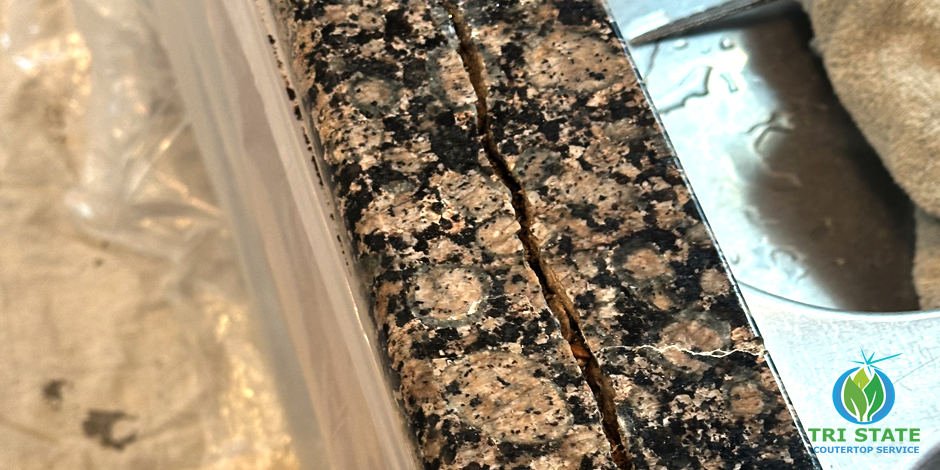 Removing old DIY repairs from a cracked granite countertop